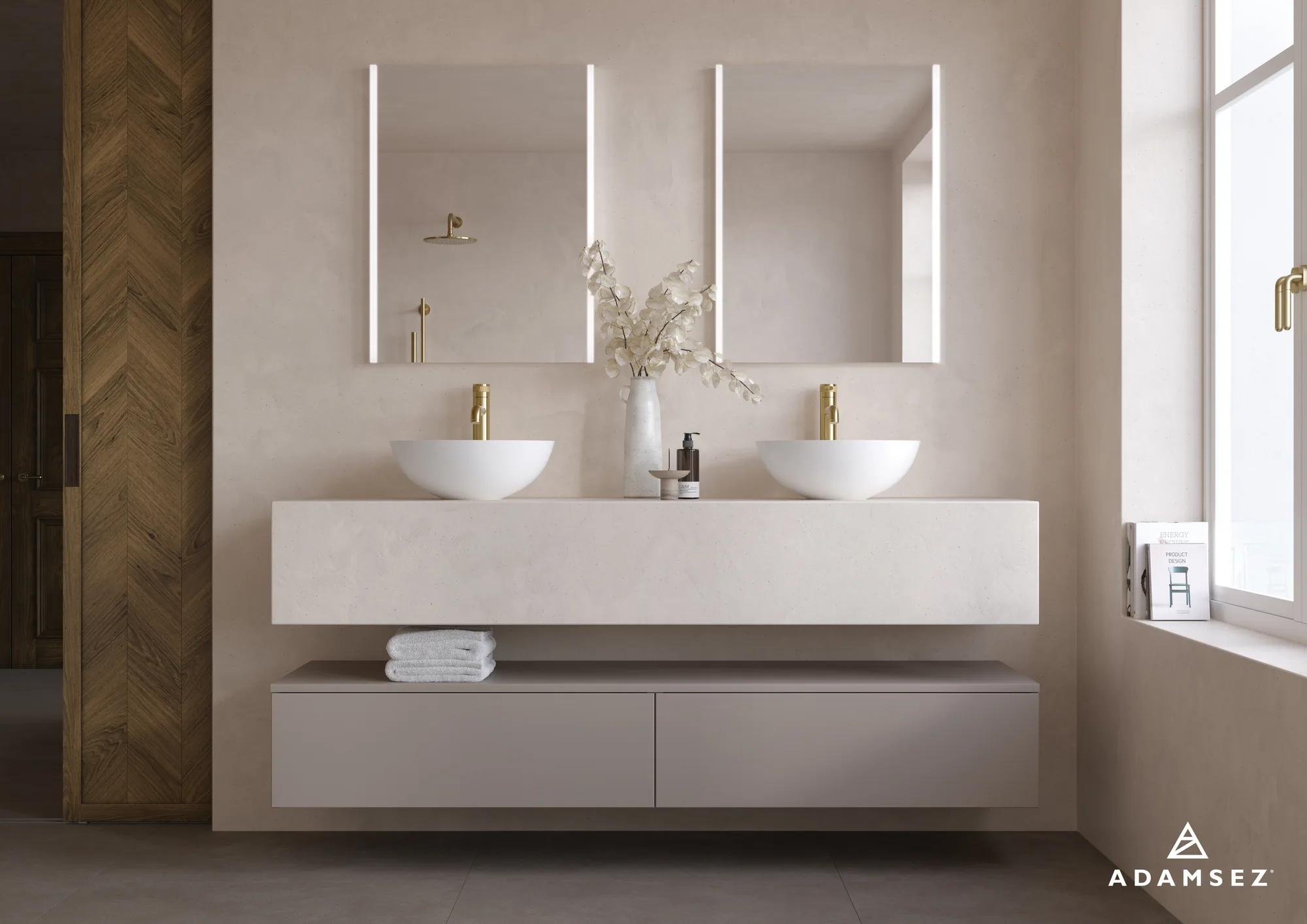 Adamsez Orb basins with brass taps and a textured, warm stone vanity