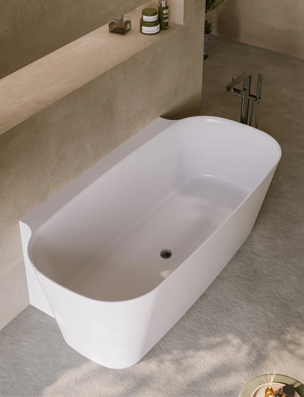 Adamsez Santo bath in a warm, textured stone interior